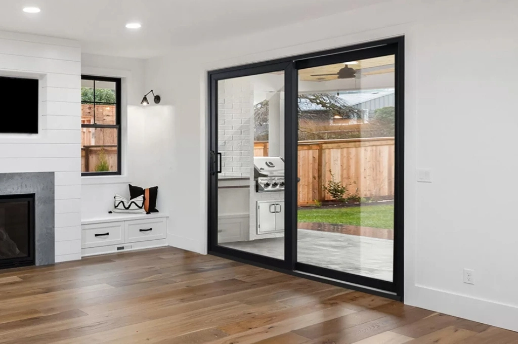 A smoothly gliding sliding glass door repair in a Plano, TX home after a successful roller and track repair by Windows And Doors Repair LLC.