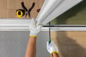 Technician replacing worn rollers on sliding glass door in Dallas home