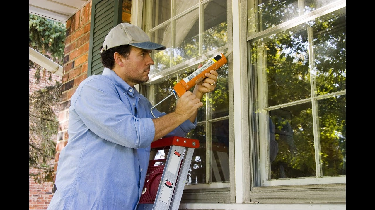 Window seal repair technician inspecting a failed insulated glass unit at a residential property in Dallas TX
